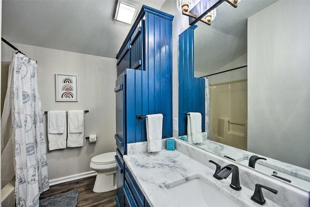 full bathroom with toilet, vaulted ceiling, vanity, shower / bathtub combination with curtain, and hardwood / wood-style flooring