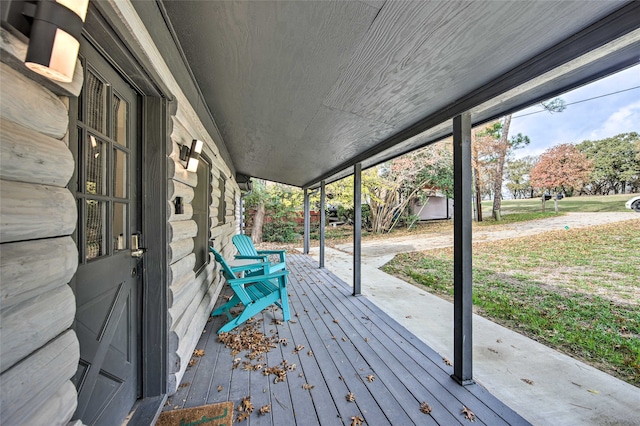 wooden deck featuring covered porch