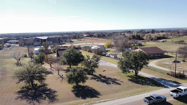 birds eye view of property featuring a rural view