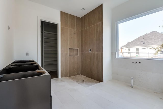 bathroom with a tile shower