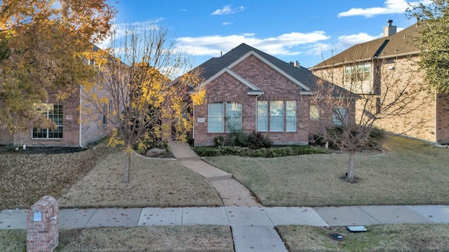 view of front of home with a front lawn