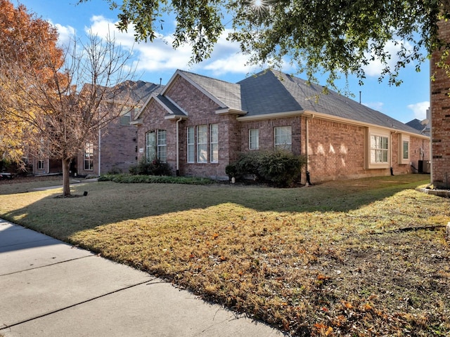 ranch-style house with a front lawn