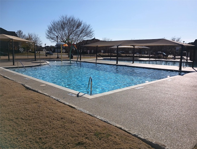 view of swimming pool with a patio