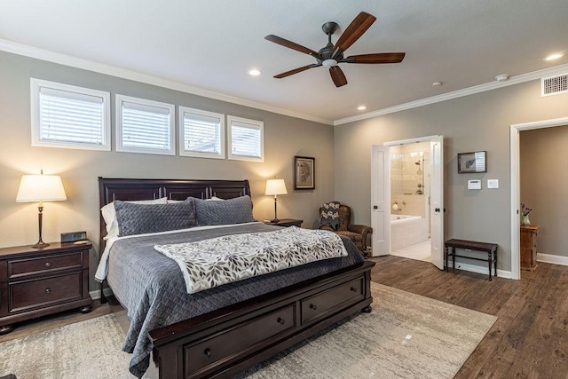 bedroom with ceiling fan, dark hardwood / wood-style floors, crown molding, and ensuite bath