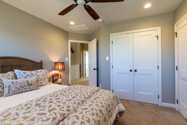 carpeted bedroom with a closet and ceiling fan