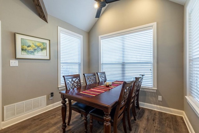 dining room featuring ceiling fan, dark hardwood / wood-style floors, and vaulted ceiling