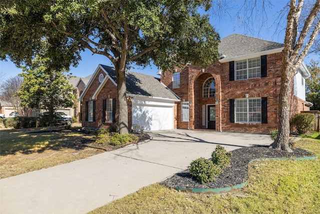 view of front facade with a front yard and a garage