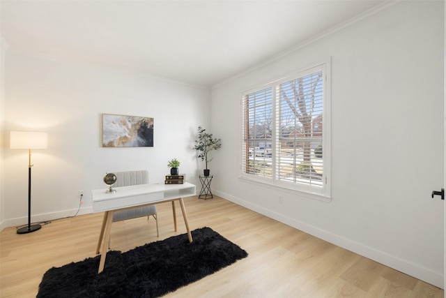 office area with hardwood / wood-style floors and ornamental molding