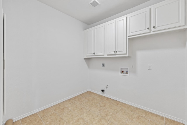 washroom with cabinets, hookup for a gas dryer, hookup for an electric dryer, and washer hookup