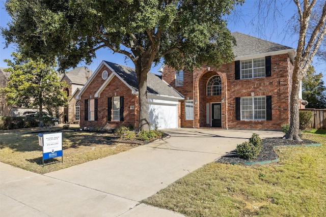 view of front facade featuring a front lawn and a garage