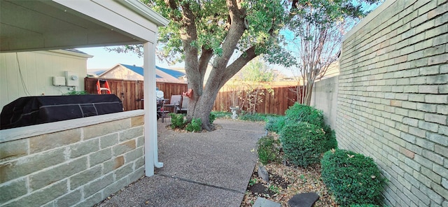 view of patio featuring a grill