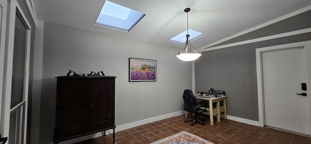 office area featuring wood walls and vaulted ceiling with skylight