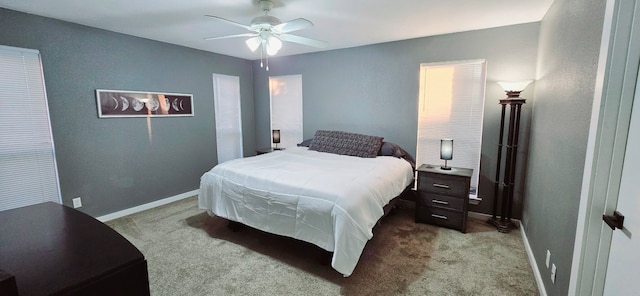 bedroom featuring light carpet and ceiling fan