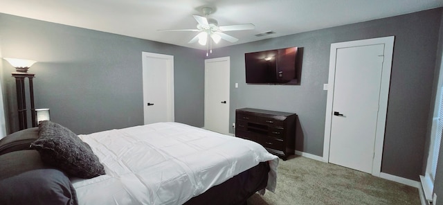 carpeted bedroom featuring ceiling fan