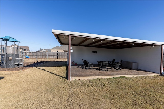 view of yard with a playground and a patio