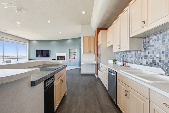 kitchen featuring decorative backsplash, light brown cabinetry, stainless steel appliances, sink, and dark hardwood / wood-style floors