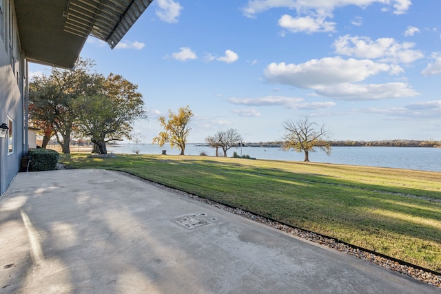 view of patio with a water view