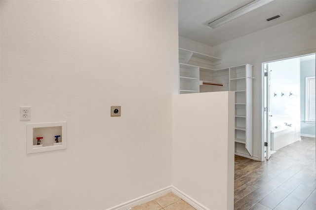 clothes washing area with hookup for a washing machine and hookup for an electric dryer