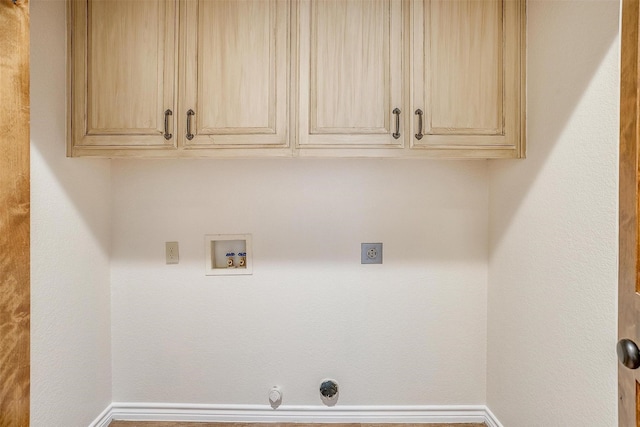 laundry room featuring electric dryer hookup, cabinets, gas dryer hookup, and hookup for a washing machine