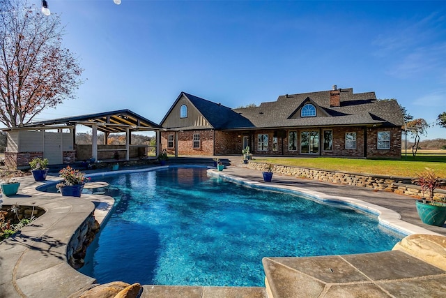 view of swimming pool featuring a yard and a patio