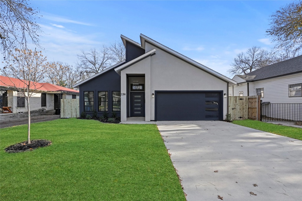 view of front facade featuring a garage and a front lawn