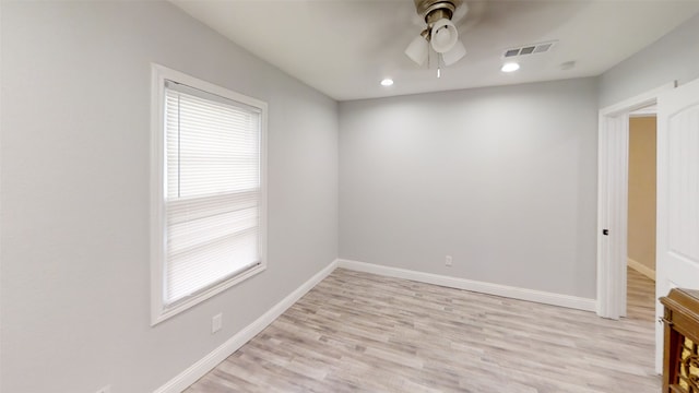 unfurnished room featuring ceiling fan and light wood-type flooring