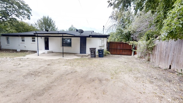 back of house with a patio area