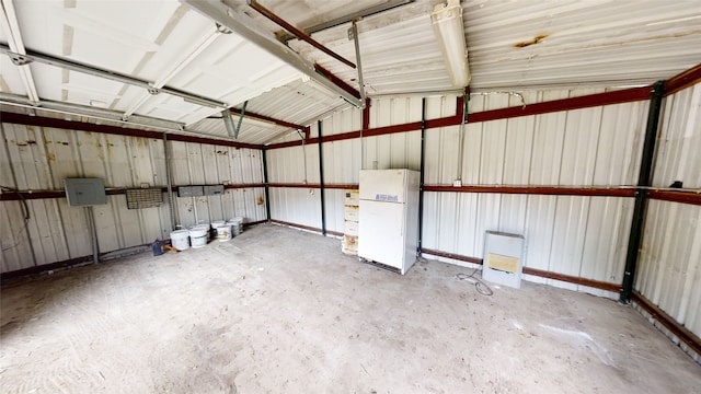 garage featuring white fridge