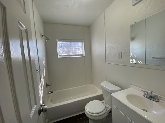 full bathroom with bathing tub / shower combination, vanity, and toilet