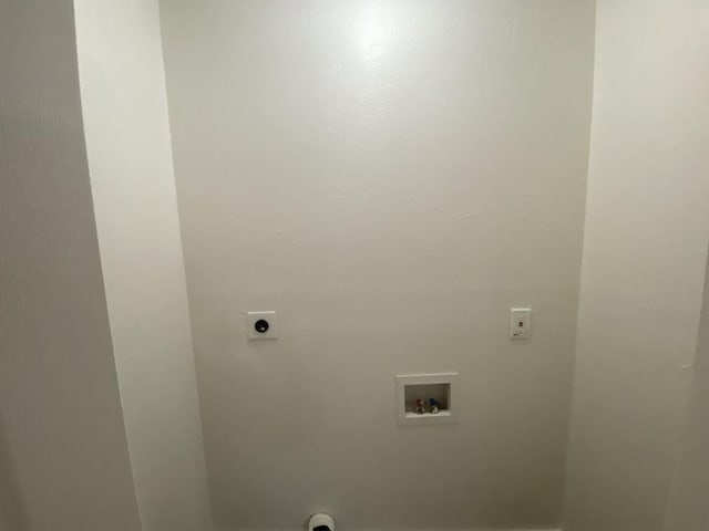 washroom with hookup for a washing machine and hookup for an electric dryer