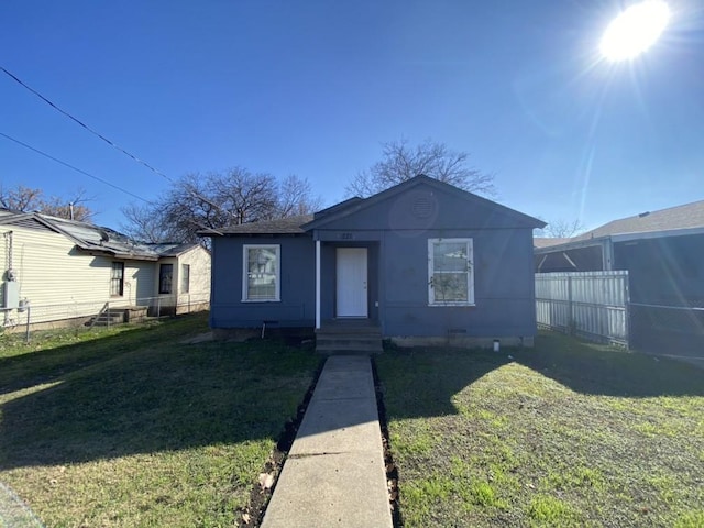 bungalow with a front yard