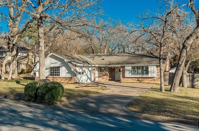 ranch-style house featuring a front lawn