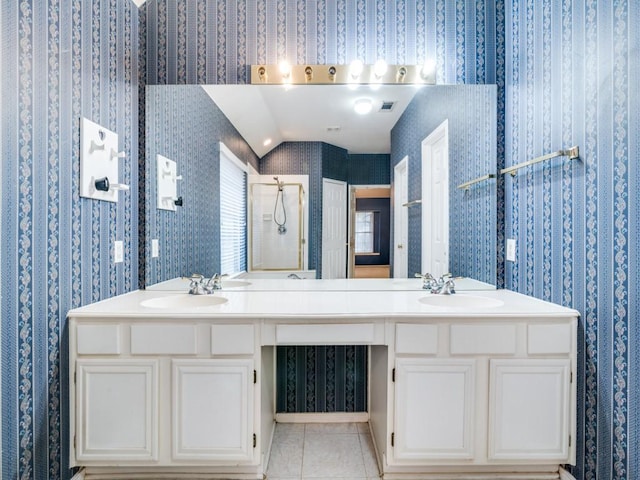 bathroom featuring a shower, tile patterned flooring, and vanity