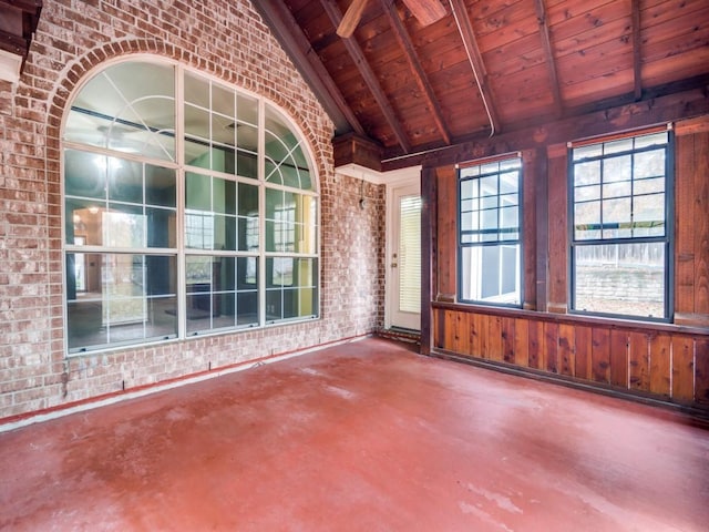 interior space with vaulted ceiling with beams and wood ceiling