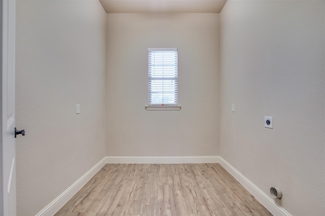 unfurnished room featuring light hardwood / wood-style floors