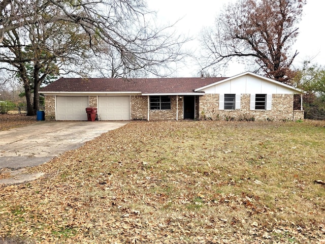 ranch-style house featuring a garage and a front yard