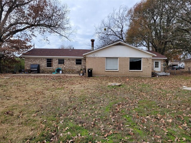 rear view of property featuring a patio area