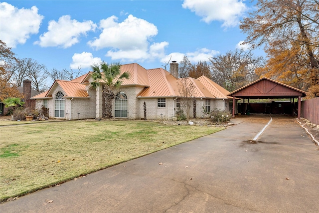 view of front of house featuring a front yard and a carport