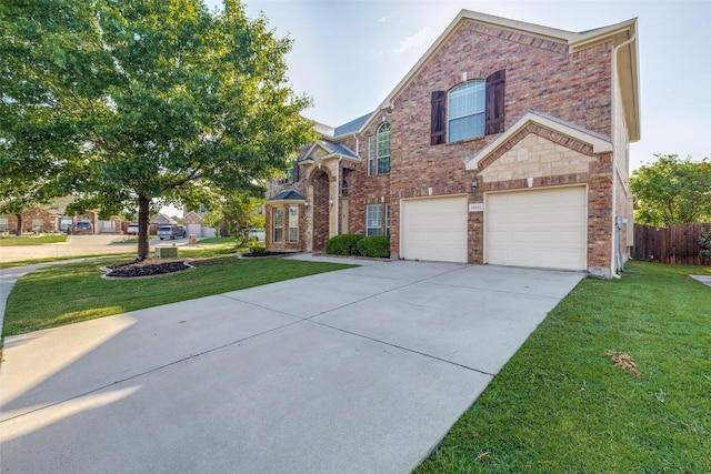 traditional-style house with brick siding, driveway, and a garage