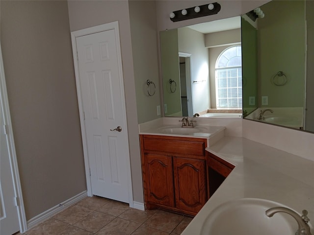 bathroom with tile patterned flooring and vanity