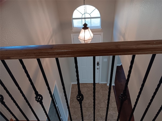 staircase featuring tile patterned floors