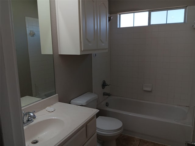 full bathroom featuring vanity, tile patterned floors, tiled shower / bath combo, and toilet