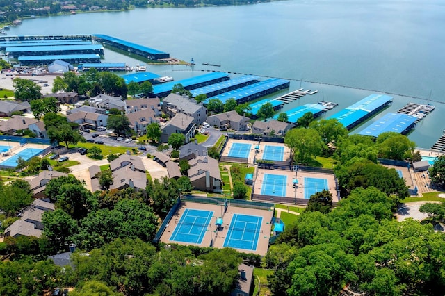 birds eye view of property with a water view