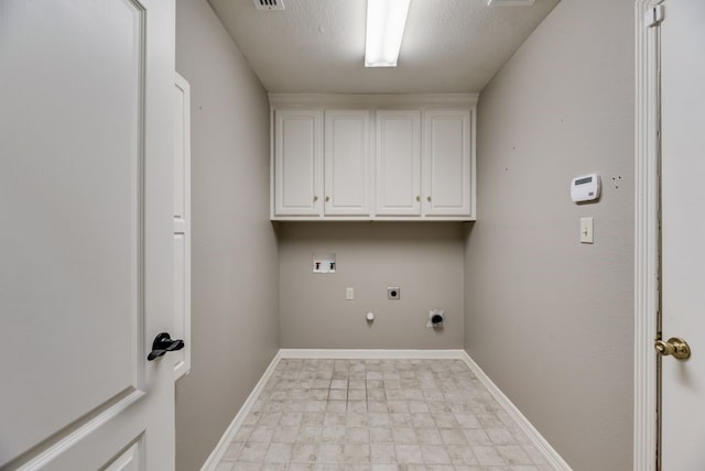 laundry room with cabinets, hookup for an electric dryer, hookup for a gas dryer, hookup for a washing machine, and a textured ceiling