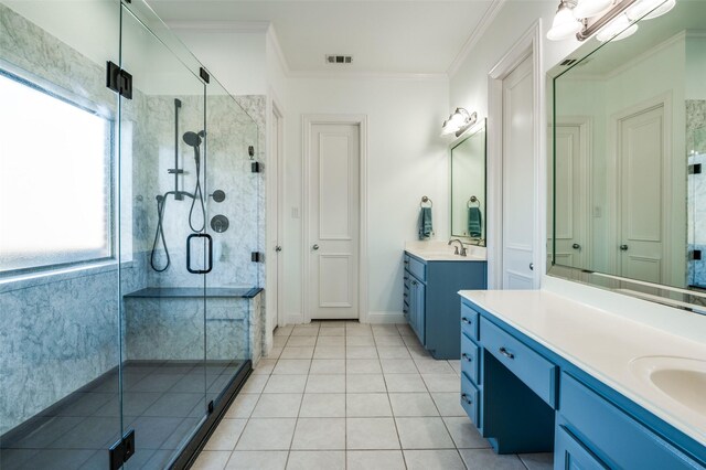 bathroom with tile patterned flooring, vanity, crown molding, and walk in shower