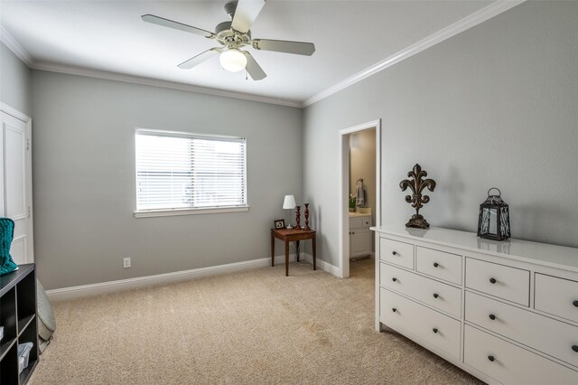 interior space featuring light carpet, ensuite bathroom, ceiling fan, and ornamental molding