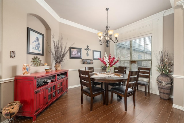 dining area featuring a chandelier and ornamental molding