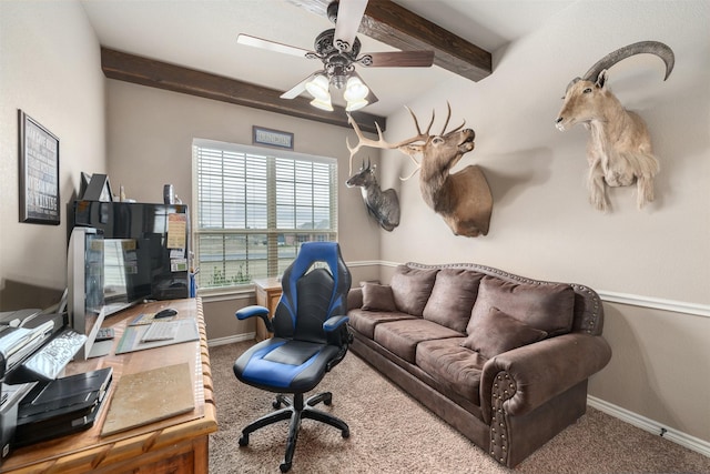 carpeted home office with beamed ceiling and ceiling fan