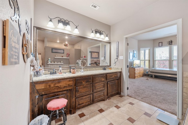 bathroom with tile patterned floors and vanity