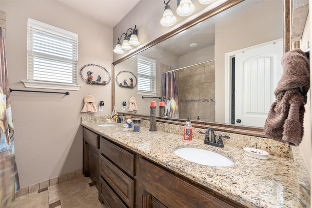 bathroom featuring a shower with curtain, tile patterned flooring, and vanity